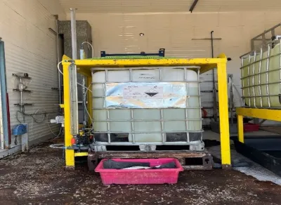 Worksite displays a bleach tote used by workers